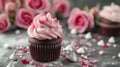 Beautiful chocolate cupcake, pink cream, meringue cookies and red roses on gray stone surface