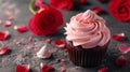 Beautiful chocolate cupcake, pink cream, meringue cookies and red roses on gray stone surface