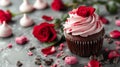 Beautiful chocolate cupcake, pink cream, meringue cookies and red roses on gray stone surface Royalty Free Stock Photo