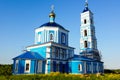 Beautiful Christian church among greenery against the sky Royalty Free Stock Photo