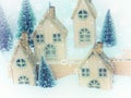 Beautiful Christmas background greeting card. Winter scenery snow forest and houses. New Year