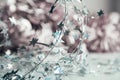 Beautiful Christmas background from silver twisted wire with stars on a blurred pale pink. Magical New Year mood Royalty Free Stock Photo