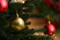 Beautiful Christmas ball hanging on fir tree branch against blurred background, closeup. Space for text Royalty Free Stock Photo