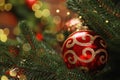 Beautiful Christmas ball hanging on fir tree branch against blurred background, closeup. Space for text Royalty Free Stock Photo