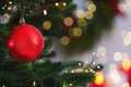 Beautiful Christmas ball hanging on fir tree branch against blurred background, closeup. Space for text Royalty Free Stock Photo