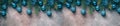 Beautiful Christmas border, fir branches decorated blue balls and tinsel on a dark textured rustic background. Top view, flat lay Royalty Free Stock Photo