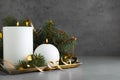 Beautiful Christmas composition with burning white candles on grey background Royalty Free Stock Photo