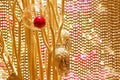 Beautiful Christmas decorations against a golden beaded curtain