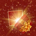 Beautiful Christmas gift box with magic light on sparkling background Royalty Free Stock Photo