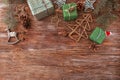 Beautiful Christmas gift boxes with decorations on wooden table Royalty Free Stock Photo