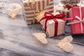 Beautiful Christmas gift boxes with decorations on wooden table Royalty Free Stock Photo