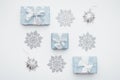 Beautiful christmas gifts and silver snowflakes isolated on white background. Christmas composition. Royalty Free Stock Photo