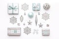 Beautiful christmas gifts and silver snowflakes and ornaments isolated on white background. Christmas composition. Royalty Free Stock Photo