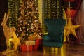 Beautiful Christmas interior with fir tree and deer Royalty Free Stock Photo