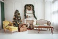 Beautiful Christmas interior. New year decoration. Living room with fireplace