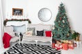 Beautiful Christmas interior. New year decoration. Comfort home. Classic new year tree decorated in a room with