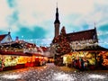 Beautiful Christmas marketplace In Tallinn old town square panorama , full moon on night sky , tree light decoration , new year