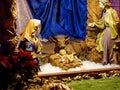 Beautiful Christmas nativity scene with holy family in a handmade wooden old stable, Italian traditional Presepio or Presepe