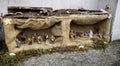 Beautiful Christmas nativity scene with holy family in a handmade wooden old stable, Italian traditional Presepio or Presepe