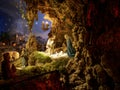 Beautiful Christmas nativity scene with holy family in a handmade wooden old stable, Italian traditional Presepio or Presepe