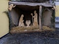 Beautiful Christmas nativity scene with holy family in a handmade wooden old stable, Italian traditional Presepio or Presepe Royalty Free Stock Photo