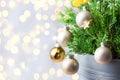 Beautiful Christmas New Year Background. Decorated potted juniper branches ornament balls golden garland bokeh lights Royalty Free Stock Photo