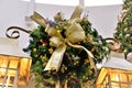 Beautiful Christmas ornament with pines, flowers and golden bow