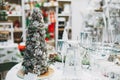 Beautiful Christmas serving with artificial Christmas tree in the home goods store holiday shopping