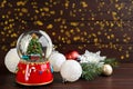 Beautiful Christmas snow globe and festive decor on wooden table. Space for text Royalty Free Stock Photo