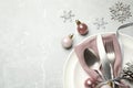 Beautiful Christmas table setting and festive decor on light grey marble background, flat lay. Space for text Royalty Free Stock Photo