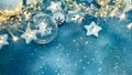 Beautiful christmas tree balls and shining star lights on blue background with confetti Royalty Free Stock Photo