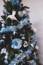 beautiful christmas tree with blue toys and tinsel