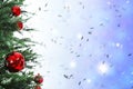 Beautiful Christmas tree with bright baubles against blurred lights on light blue background, closeup. Space for text Royalty Free Stock Photo