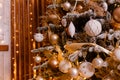 Beautiful Christmas tree is close. Golden Christmas. golden and white balls on Christmas tree branches