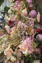 Beautiful christmas tree decorate composition with baubles, flowers and garland
