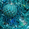 Flatlay Of New Year Or Christmas Decorations Of Turquoise Color: Tinsel, Balls, Garlands, Stars