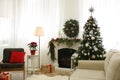 Beautiful Christmas tree with star topper in decorated room Royalty Free Stock Photo