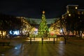 Beautiful Christmas tree and street decorations at night in downtown Frisco