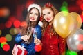 Beautiful Christmas women smiling. Winter fashion girls on abstract bokeh glitter sparkle party background