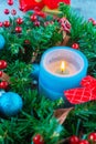 Beautiful Christmas wreath,blue candle,berries