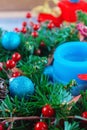 Beautiful Christmas wreath,blue candle,berries