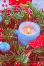 Beautiful Christmas wreath,blue candle,berries