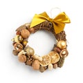 Beautiful Christmas wreath consisting of dried orange slices, nuts, cones, decorated with a large yellow bow on a white background
