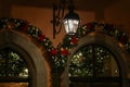 Beautiful Christmas wreath decorations on an arched wall Royalty Free Stock Photo