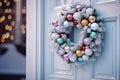 Beautiful Christmas wreath hanging on entrance door. Elegant Christmas wreath with pastel color Christmas decoration Royalty Free Stock Photo