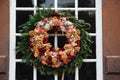 A Christmas wreath hangs on the door