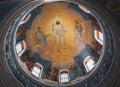 Beautiful church dome with stained glass windows. Church ceiling with religious painting. Painted cathedral ceiling.