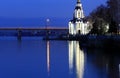 Beautiful church with illuminating at autumn night, lights reflected in the river Dnieper. Royalty Free Stock Photo