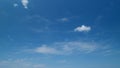 Beautiful cirrus uncinus clouds in blue sky. Clear weather, sunny day. Beautiful white cirrus clouds. Timelapse. Royalty Free Stock Photo