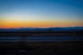 Sunset empty field and mountains